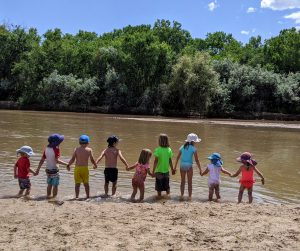 Our community children playing at the Rio Grande beach walking distance from our community.